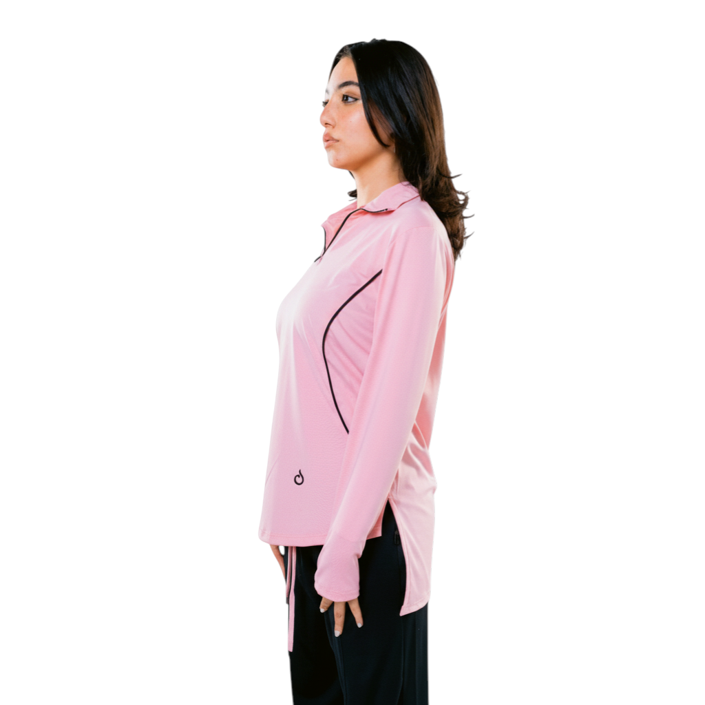 Meryia RASM Zip Top in blush pink, a lightweight, breathable longline top with a half-zip neckline and subtle seam detailing.