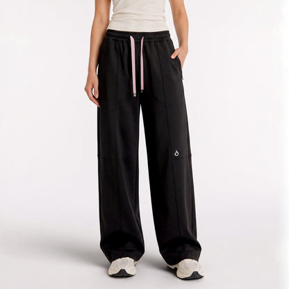 Meryia LAYN black straight-fit pants with an elastic drawstring waistband, worn by a model in a studio setting. | Meryia مِرية