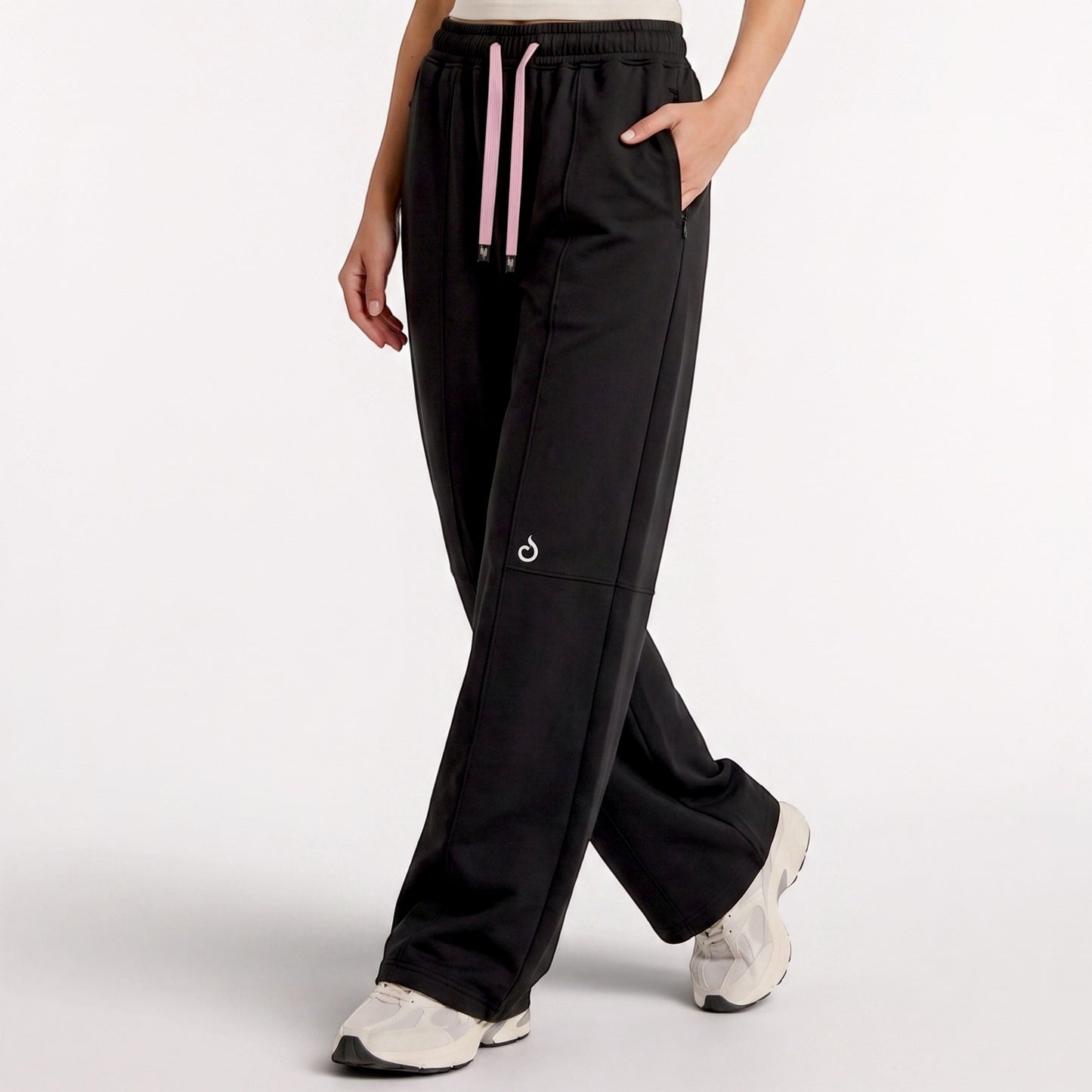 Meryia LAYN black straight-fit athletic pants with a pink drawstring and elastic waistband on a model.