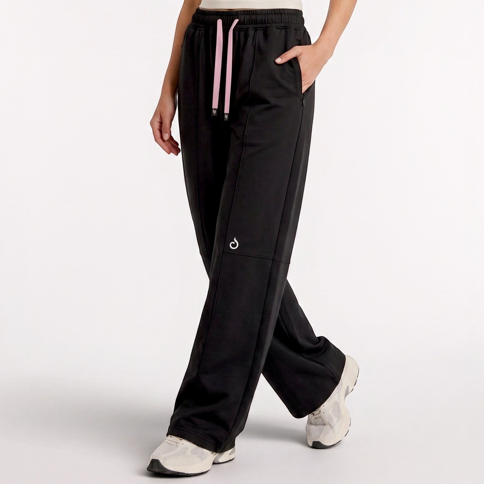 Meryia LAYN black straight-fit athletic pants with a pink drawstring and elastic waistband on a model.