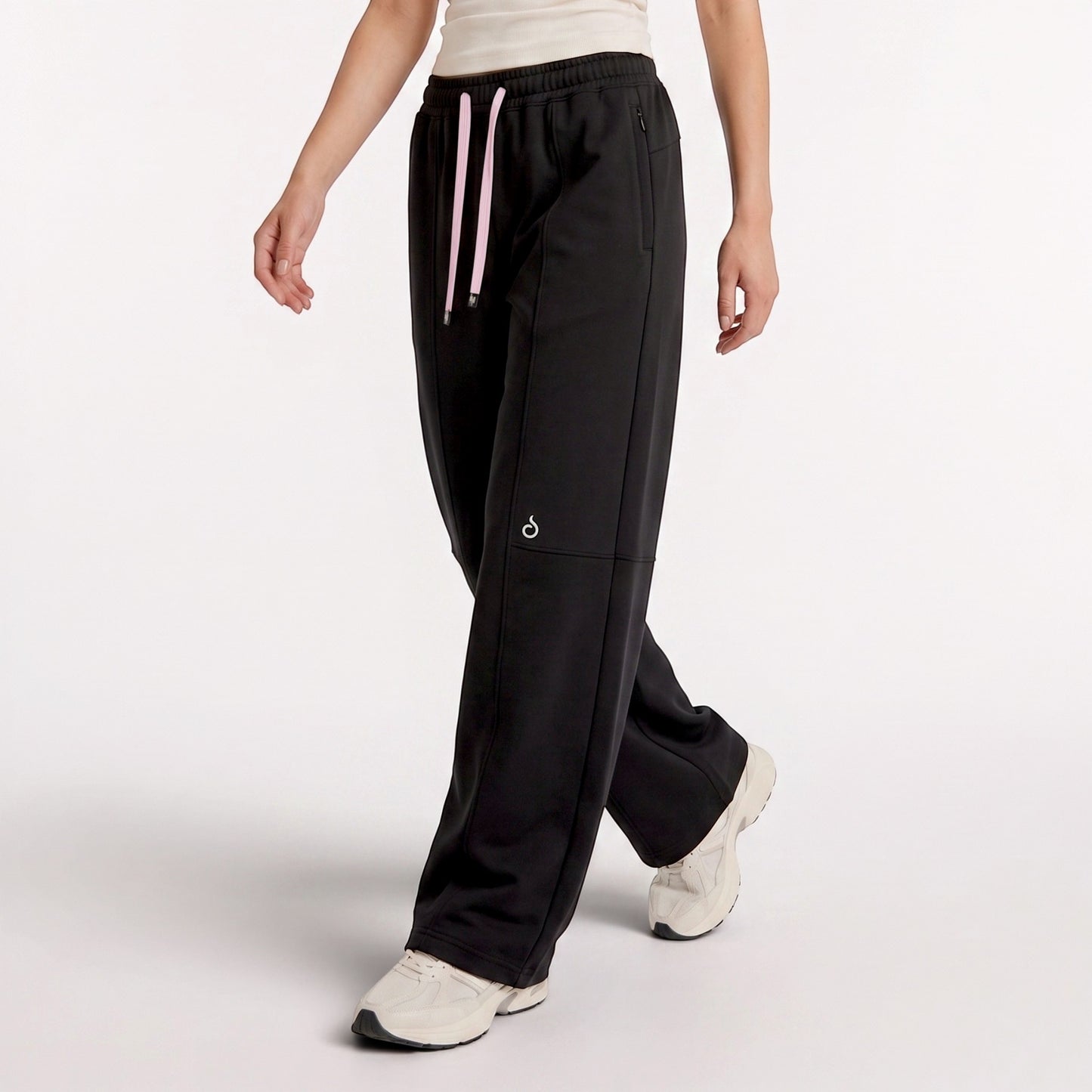 Meryia LAYN black straight-fit pants with an elastic drawstring waistband, worn by a model in a studio setting.