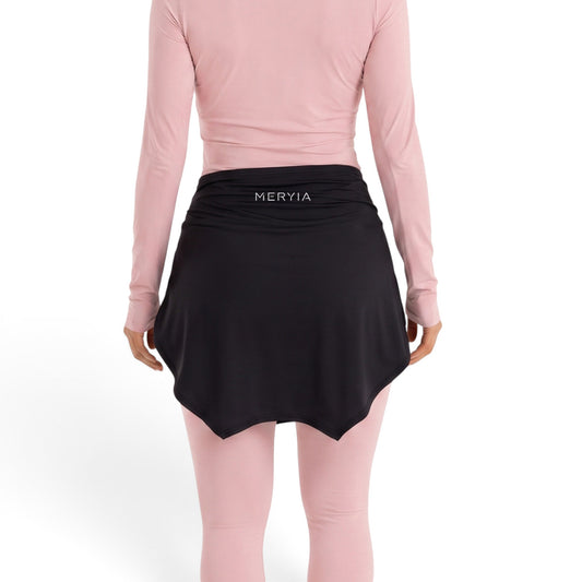 Back view of Meryia SATR Hip Cover in black worn over a light pink long-sleeve top and leggings for modest coverage. | Meryia مِرية